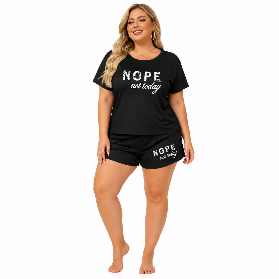 Plus size letter print sleepwear with short bottoms and soft top, designed for comfortable lounging through every season now!