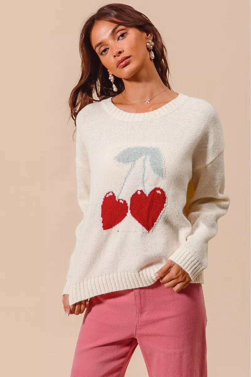 Cherry heart sweater worn casually with jeans for romantic day look