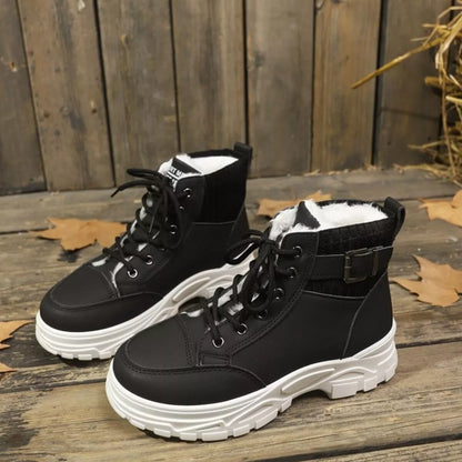 Women's warm winter lace up boots in tan color styled with black leggings and coat