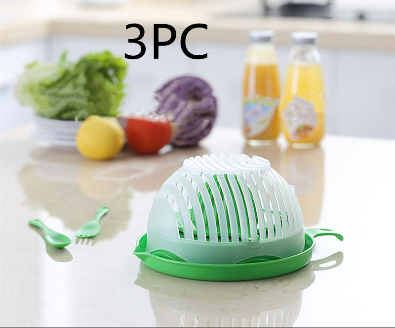 Green kitchen tool on a counter with vegetables and juice in the background
