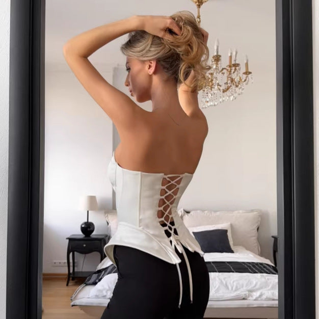 Elegant strapless tube top styled with fitted pants for date night and party outfit inspiration

