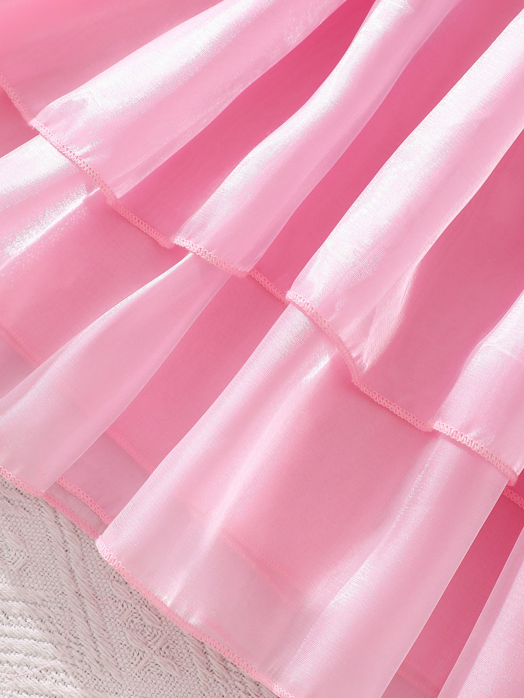 Close-up of a pink ruffled fabric texture