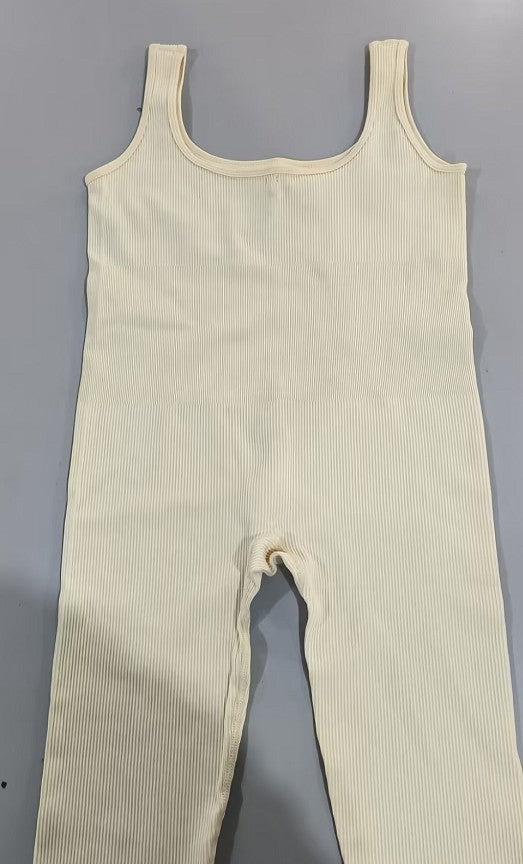 Beige ribbed jumpsuit on a gray background
