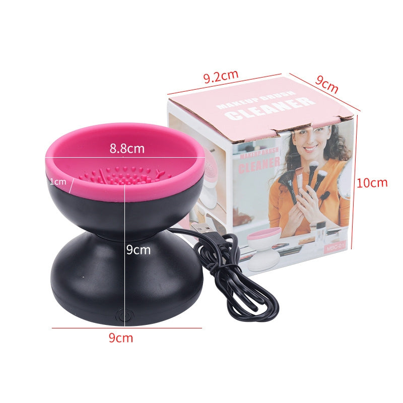 Black and pink device with measurements and a box in the background