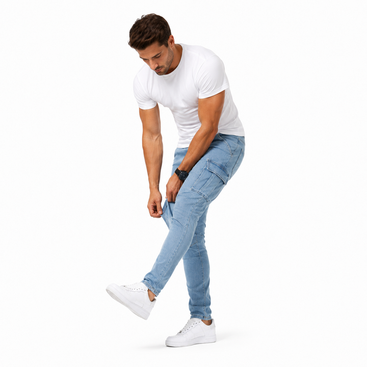 Man wearing a white t-shirt and light blue jeans on a white background