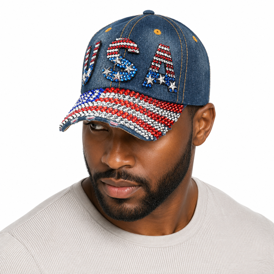 Close-up of red, white and blue rhinestones on a navy washed denim baseball cap designed for USA fans and game watch parties.

