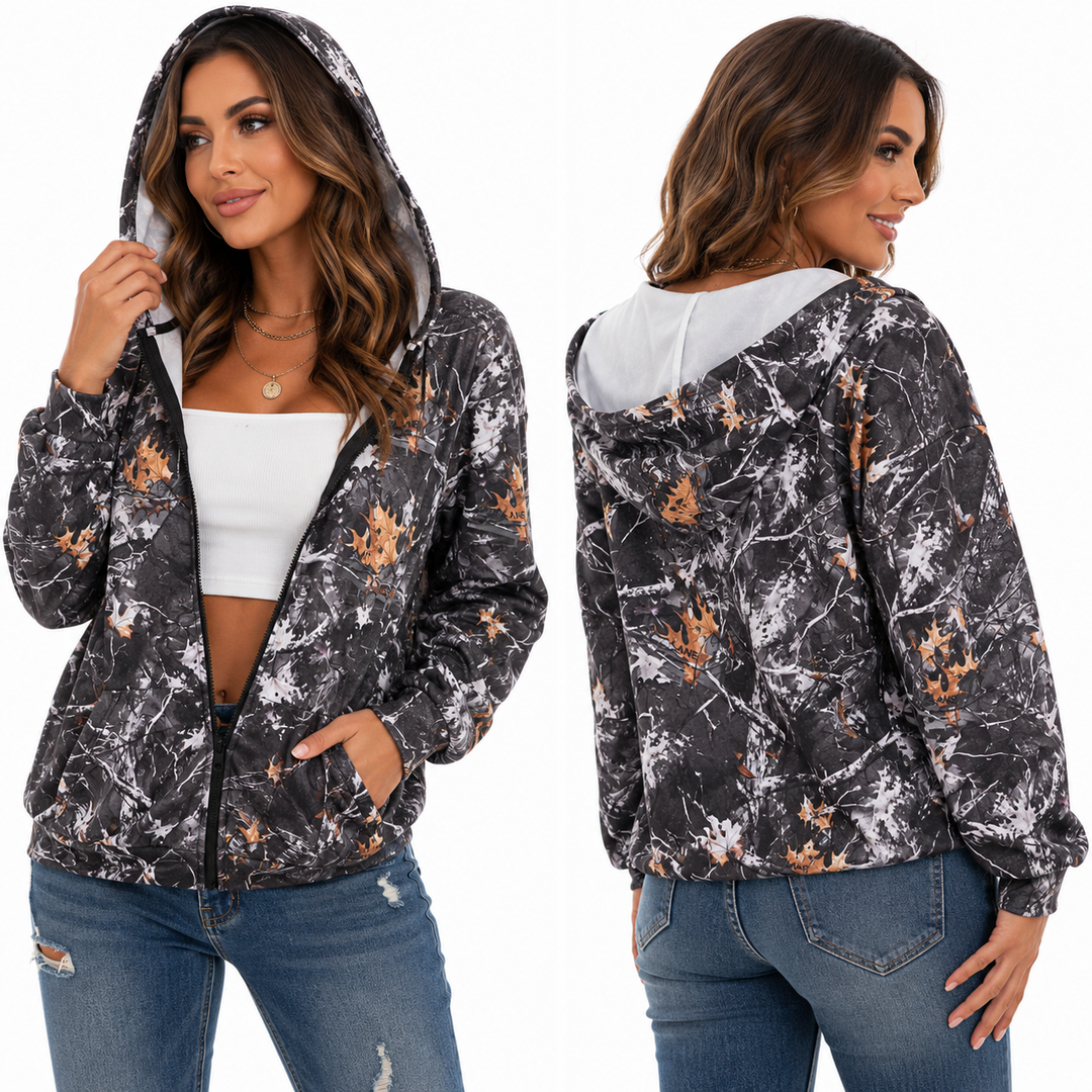 Women vintage zip-up hoodie with camo leaf print, zipper front, pockets, and relaxed streetwear fit on white background.