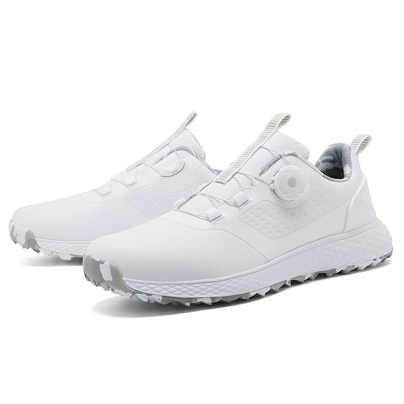 White rotary buckle footwear displayed as a pair on a white studio background, with the side fastening and low profile clear.
