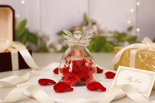 eternal flower gift box close-up of dried rose stem inside glass bottle with angel silhouette for gift-ready decor
