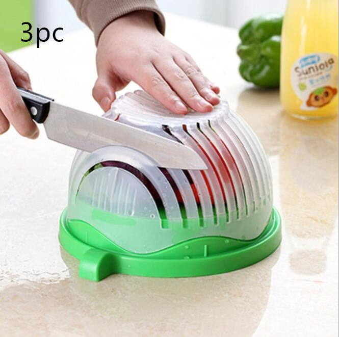 Hand placing fresh cucumber slices into the BPA-free salad chopper bowl
