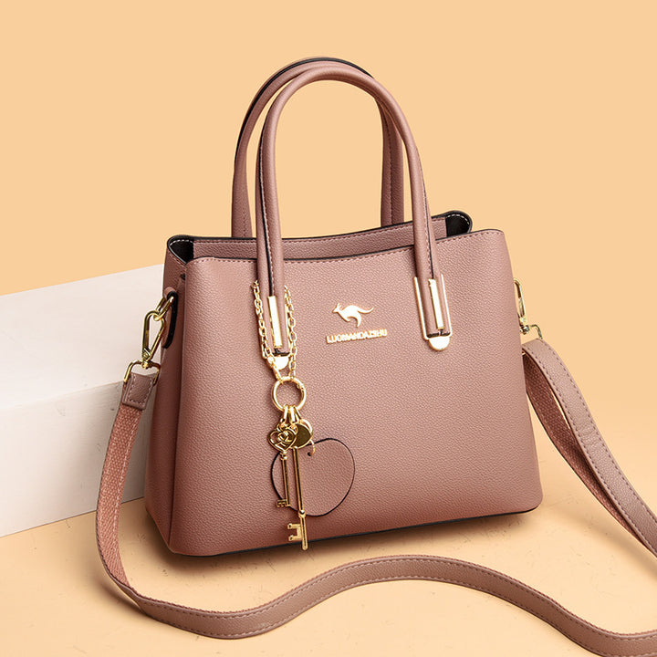 Large women's handbag with lychee texture and key charm