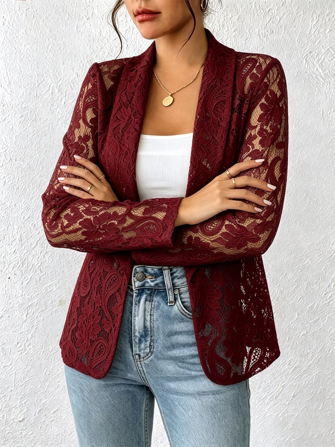 Wine red floral cardigan on a model, shown from the front. The floral lace is shown in the pictured style and garment design.