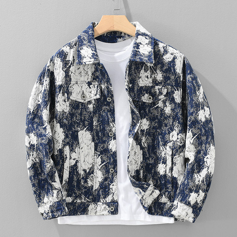 Floral patterned jacket on a hanger against a gray background
