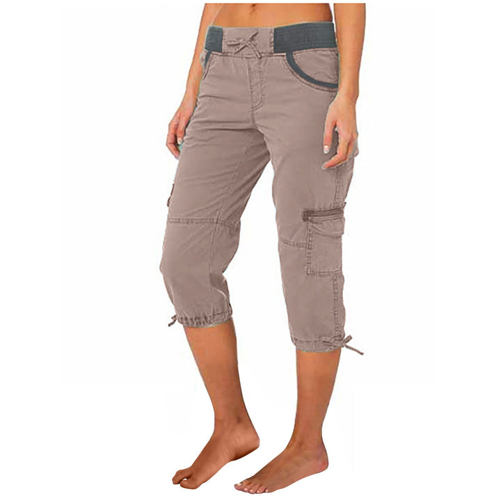 Brown capri pants worn by a person on a white background