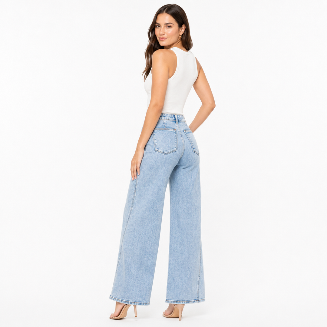 Full size high rise jeans with wide leg cut, slight stretch fabric and skewed inseam detail for modern wardrobe looks wear no