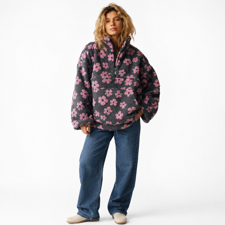 Sherpa pullover with kangaroo pocket, floral pattern, half-zip lapel collar and loose silhouette for casual cold-day outfits.
