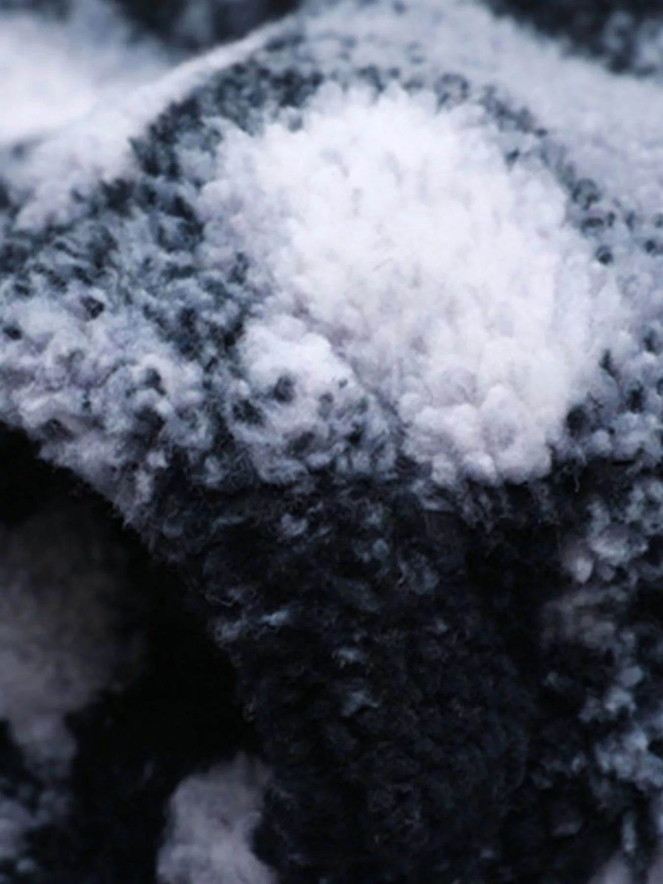 Close-up abstract geometric pattern on men's 4XL plus size fleece jacket fabric detail