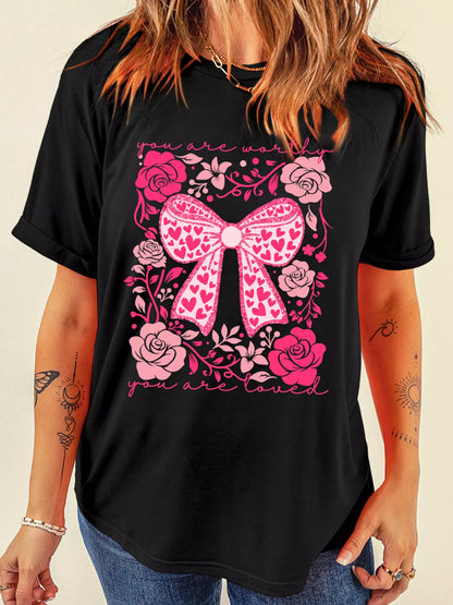 Womens valentines day graphic tee styled with blazer and denim, floral bow slogan tee creating quiet luxury date night look