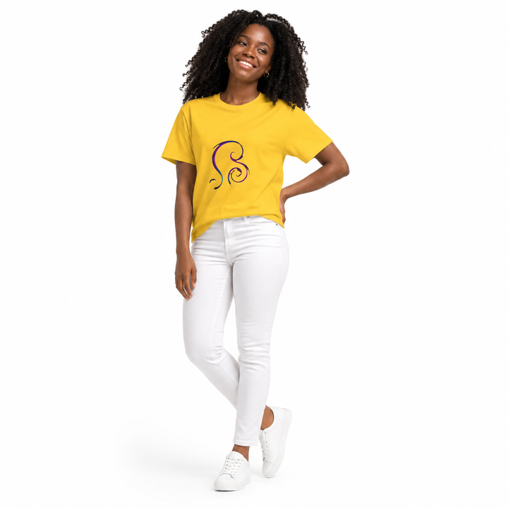 A woman modeling a bright yellow short-sleeve t-shirt with a black stylized swirl graphic on the chest, paired with white pants and white sneakers, against a plain white background.
