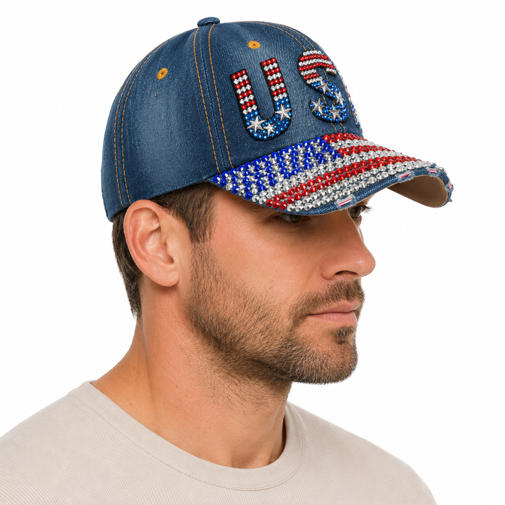 Side view of navy denim fan hat showing the classic curved brim, sparkling rhinestone decoration and adjustable one-size fit.

