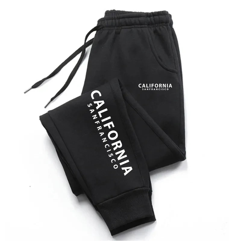 Black graphic sweatpants with California lettering, matching drawstrings and ankle cuffs, folded on a clean white background.