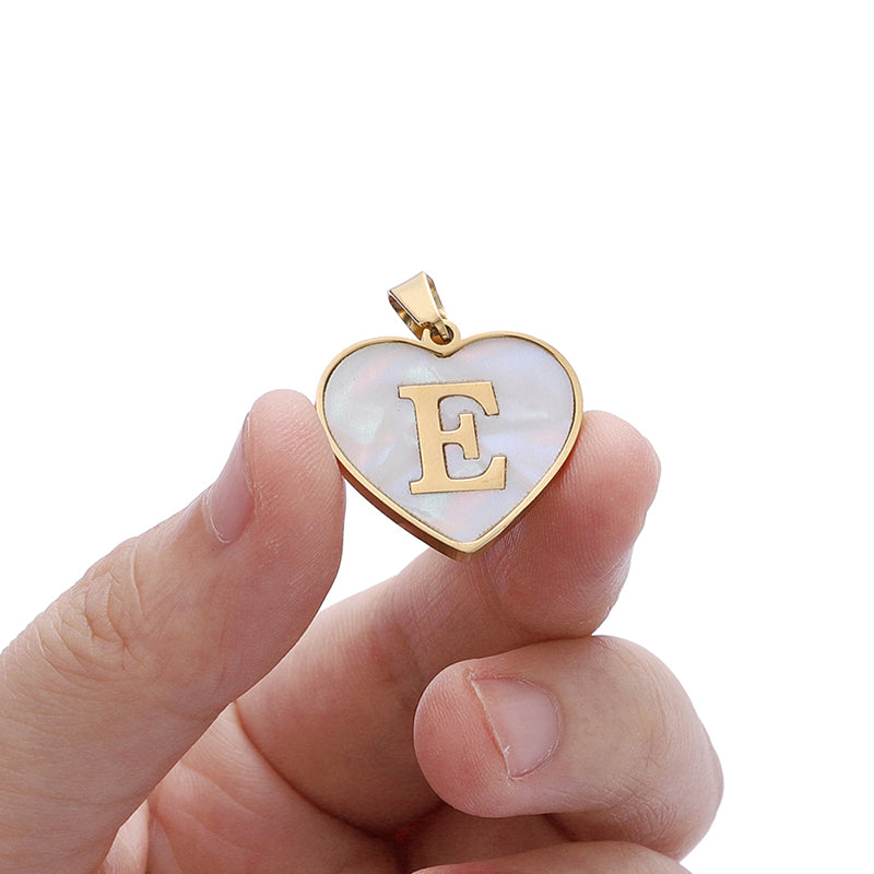 Heart-shaped initial necklace with gold-plated finish, stainless steel construction and alphabet options - Product reference.