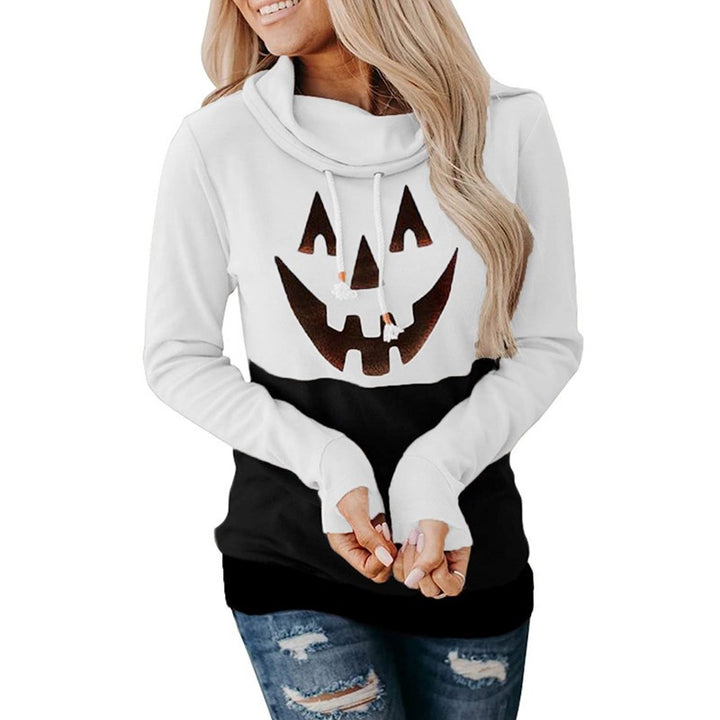 Supplier photo of a white and black pullover with a pumpkin face graphic, long sleeves and folded collar with two drawstrings