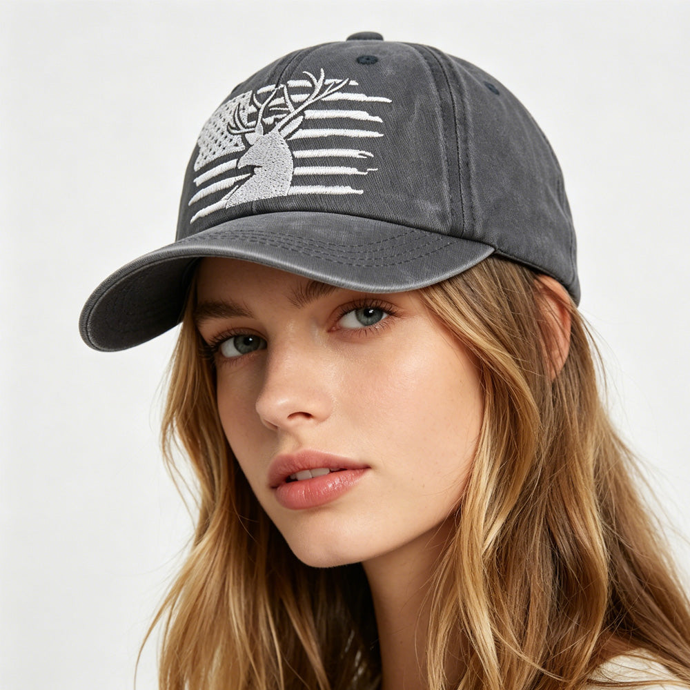 Woman wearing a gray cap with a white logo on a light gray background