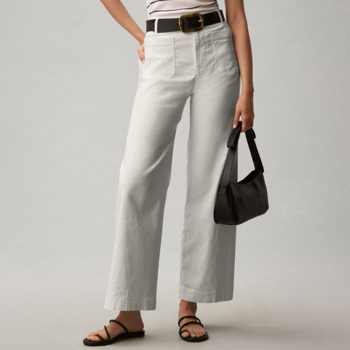 cropped tailored trousers women light gray smooth polyester fabric texture close detail
