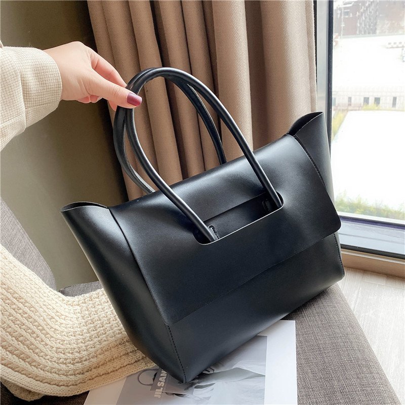 women shoulder bag front profile highlighting retro inspired square silhouette