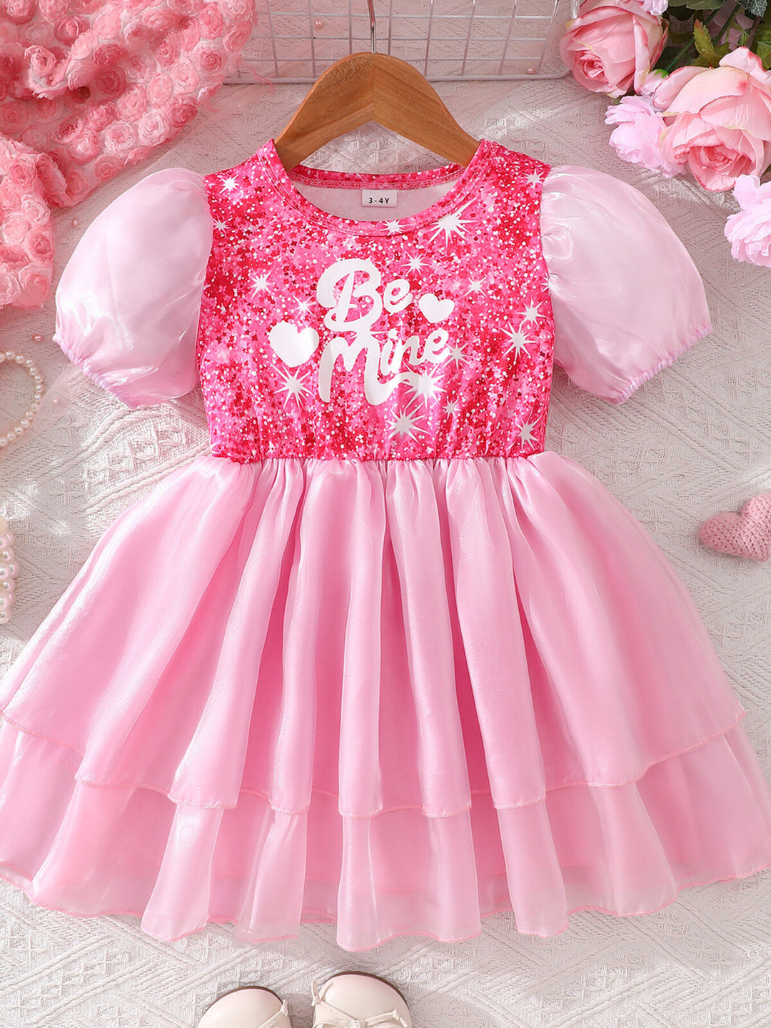 Pink puff sleeve dress for girls styled for birthday parties, holiday photos, and special celebrations