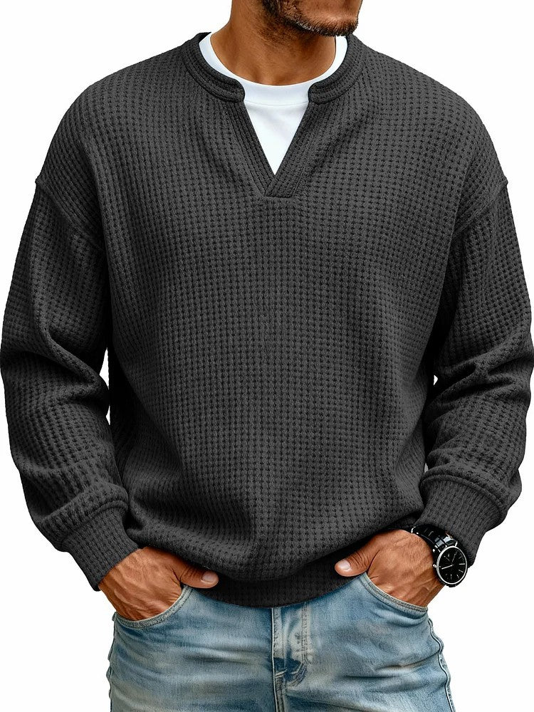 Folded men’s waffle knit shirt featuring detailed texture and classic casual styling