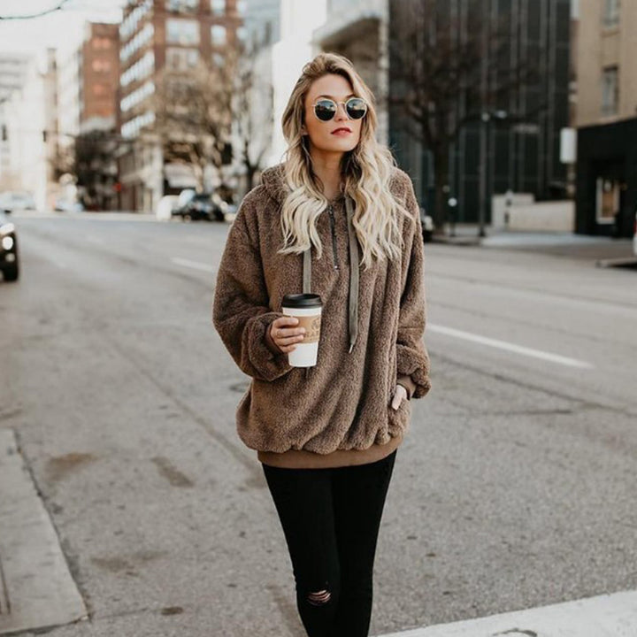 women’s fleece hoodie green relaxed silhouette side angle natural light context