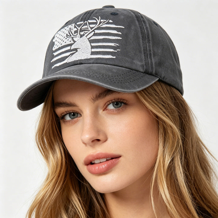 Woman tying back ponytail under adjustable American flag deer hat on misty lake dock at sunrise