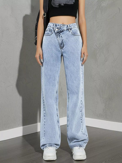 high rise wide leg jeans waistband and belt loop detail in light wash denim paired with shoulder bag for everyday wear
