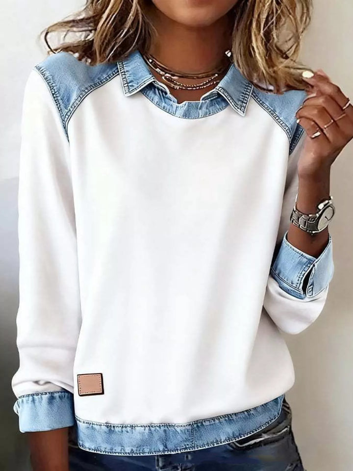 plus size denim long sleeve top close view of collar and shoulder contrast trim elegant everyday styling against neutral backdrop