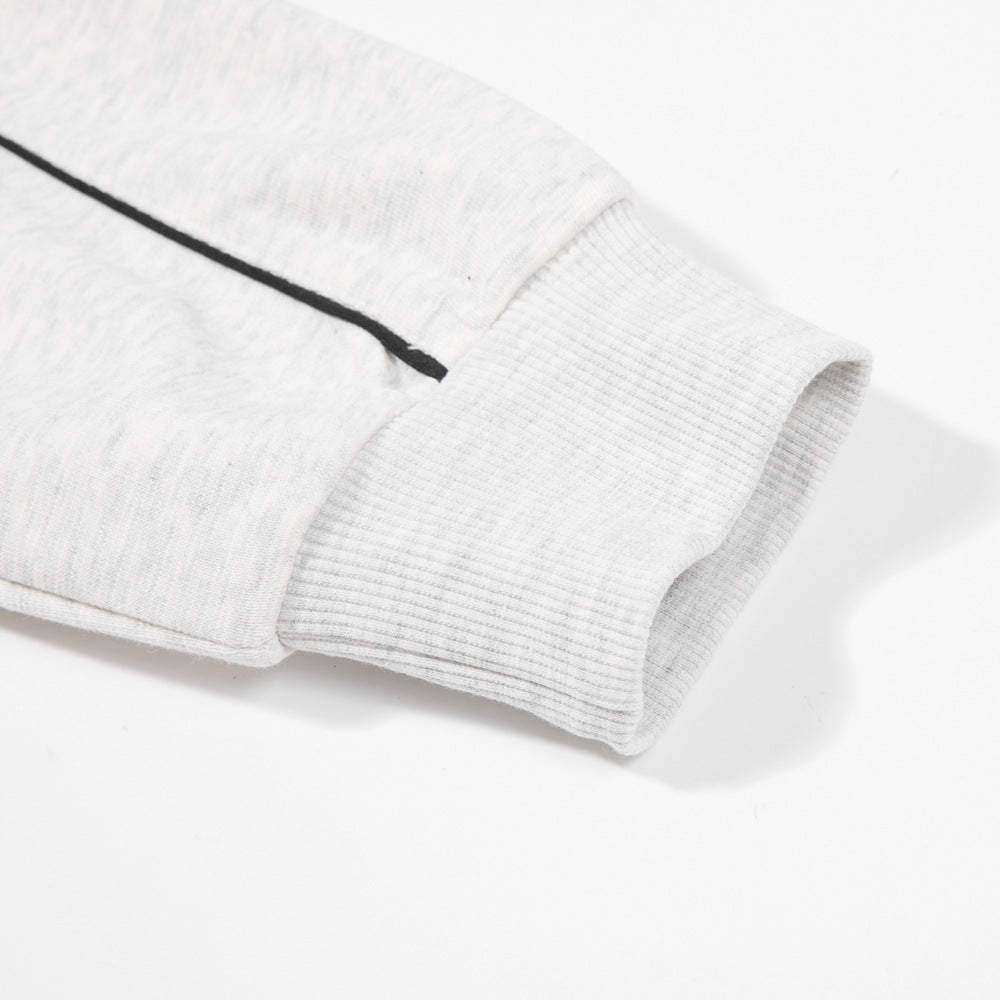 Close-up of the Modern Gray pullover sleeve showing dark contrast line, ribbed cuff and fabric surface on a white background.