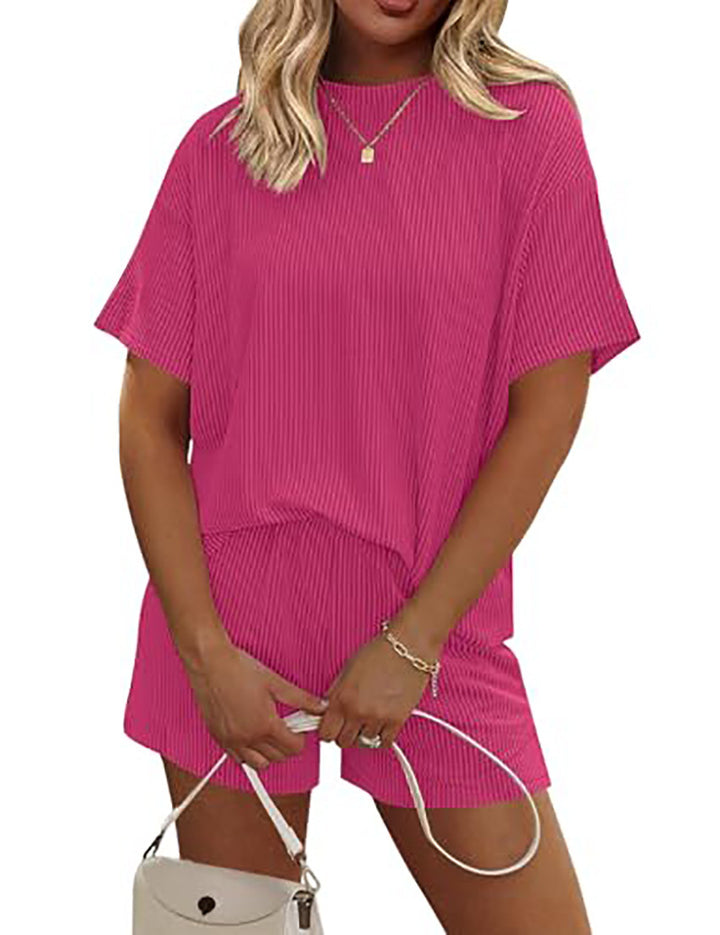 Woman wearing a pink outfit with a white background