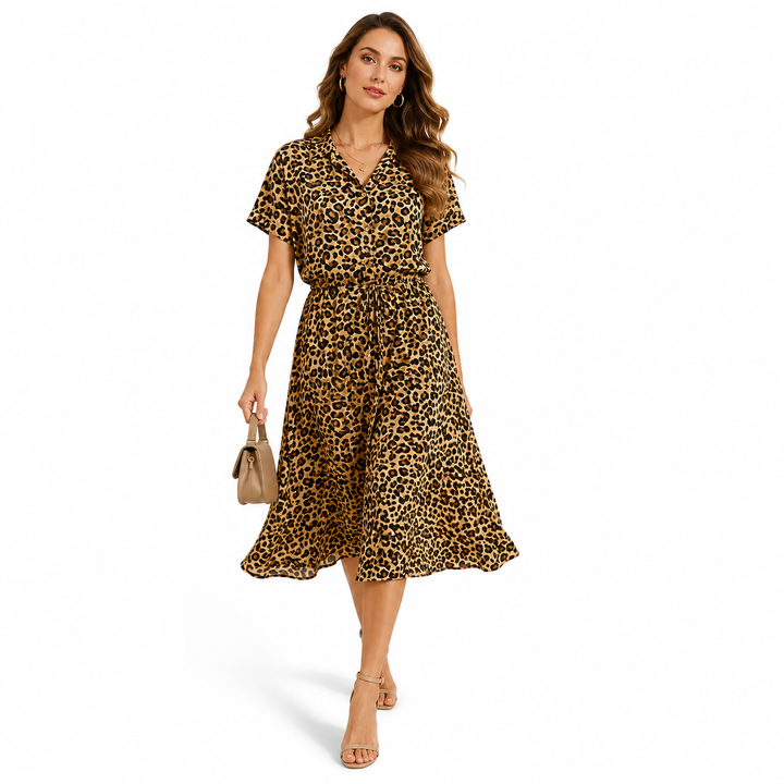 Flowing polka dot chiffon dress side view showing light skirt movement, soft drape and refined shirt collar detail in summer.