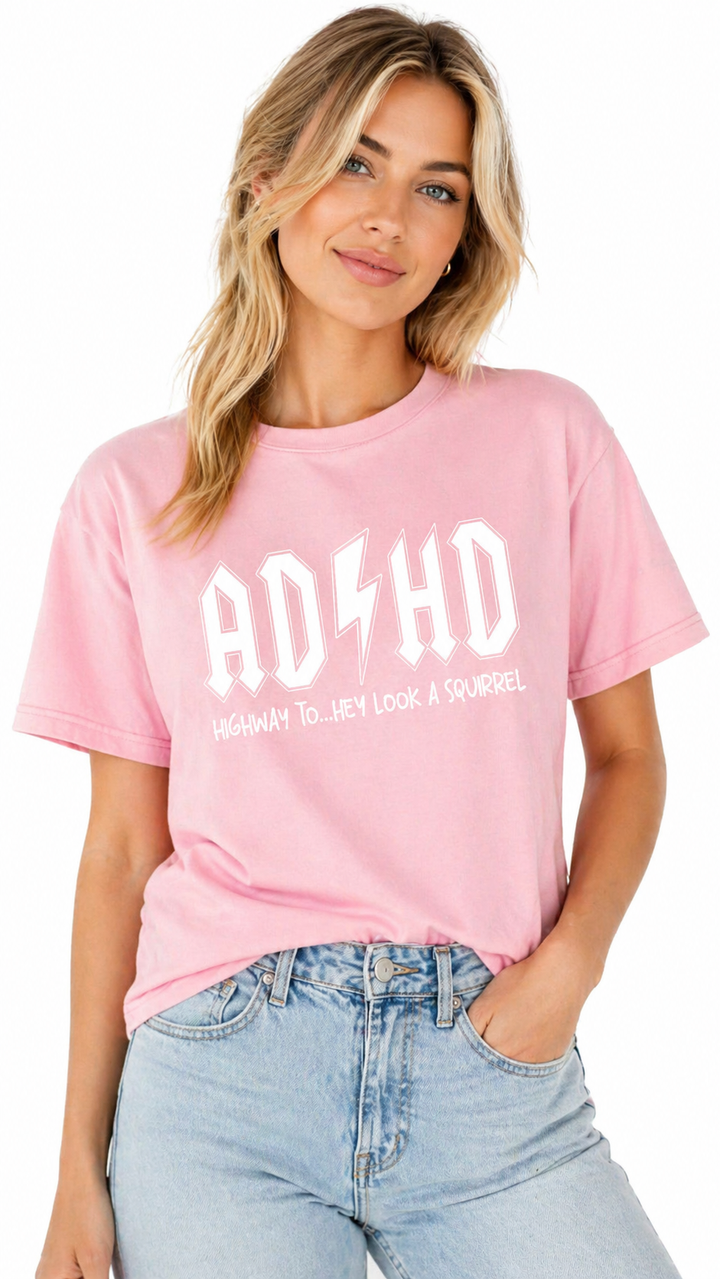 Woman wearing a pink t-shirt with &