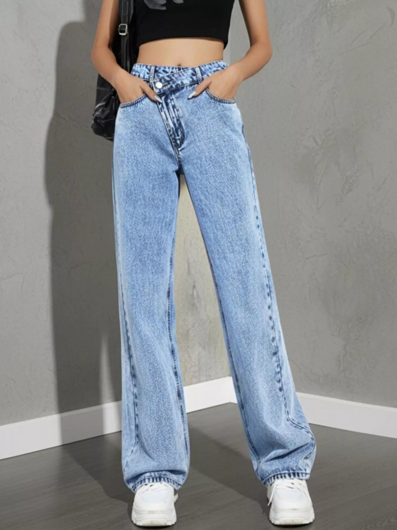 high rise wide leg jeans back view showing pocket placement light wash denim wide leg cut and clean straight drape
