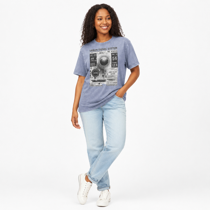 Woman styling the vintage blue acid wash graphic T shirt with light jeans in a clean white studio lifestyle pose.