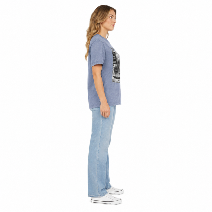 Side view of a woman wearing the vintage blue acid wash graphic T shirt, showing the relaxed silhouette and sleeve length.