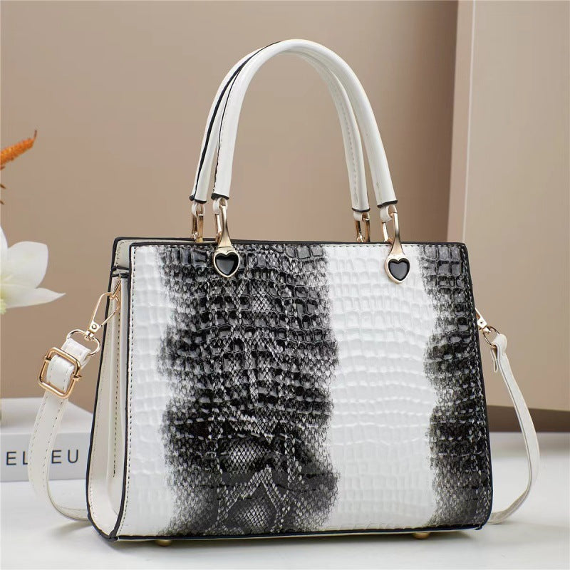 Handbag with black and white pattern on a neutral background