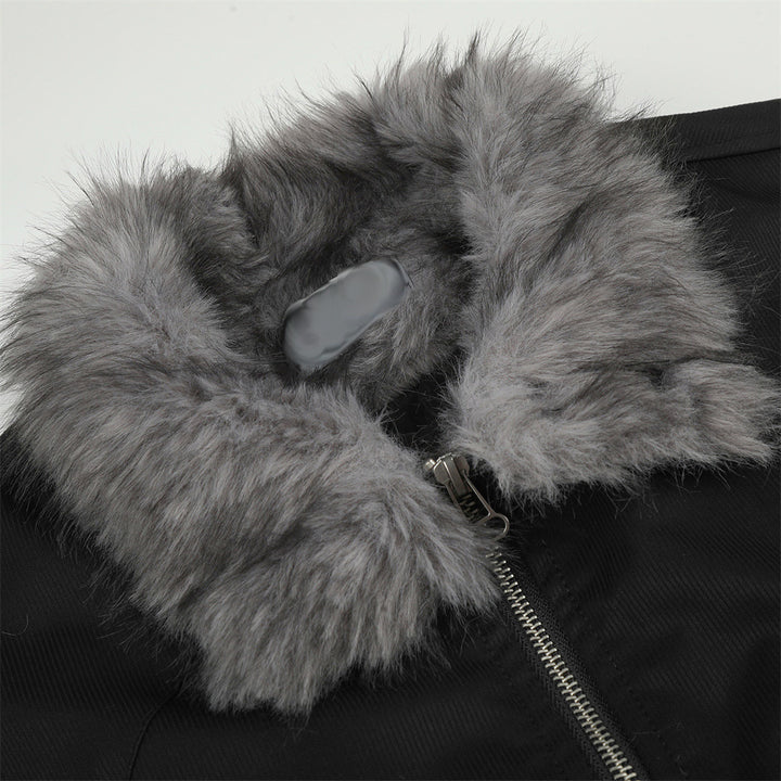 Close view of the grey faux fur collar on the black bomber jacket, showing the collar texture, silver zipper and black fabric