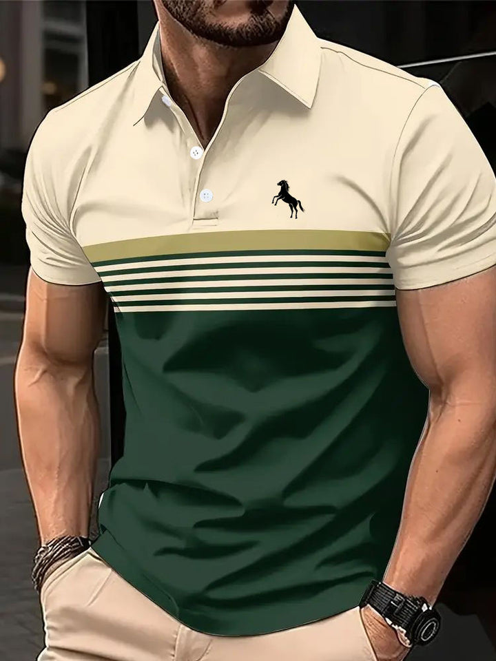 Man wearing a green and beige striped polo shirt with a logo.