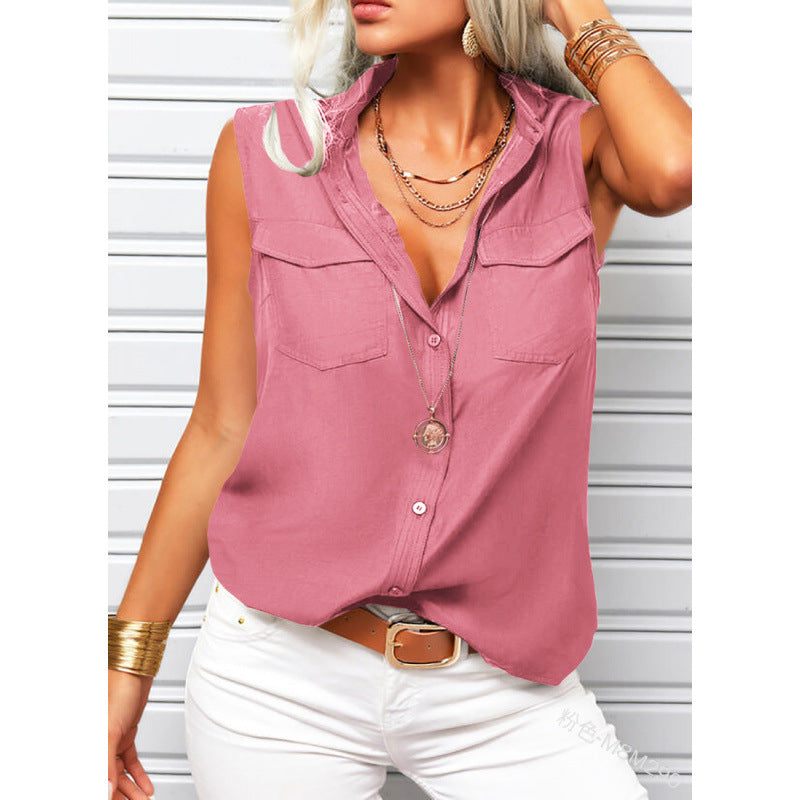 Woman wearing a pink sleeveless button-up shirt with white pants against a light background