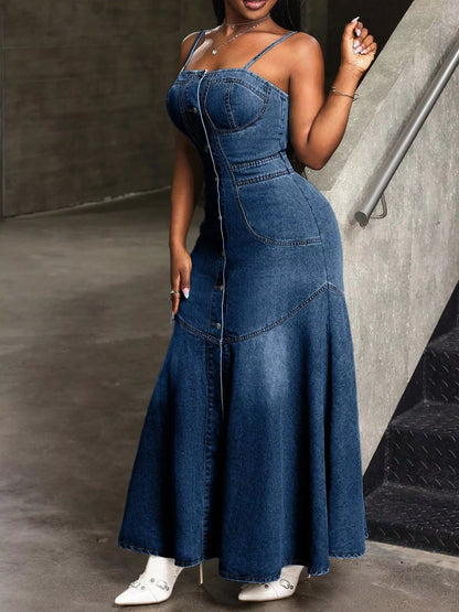 denim dress with slit hem detail close-up on blue denim fabric, showing clean finishing and movement-friendly opening
