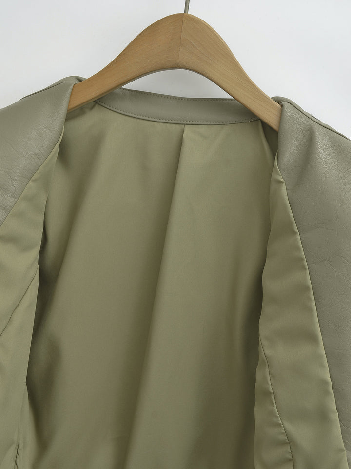 Gray Green jacket open on a hanger showing the inner lining, with the stand collar and front opening visible in close detail.