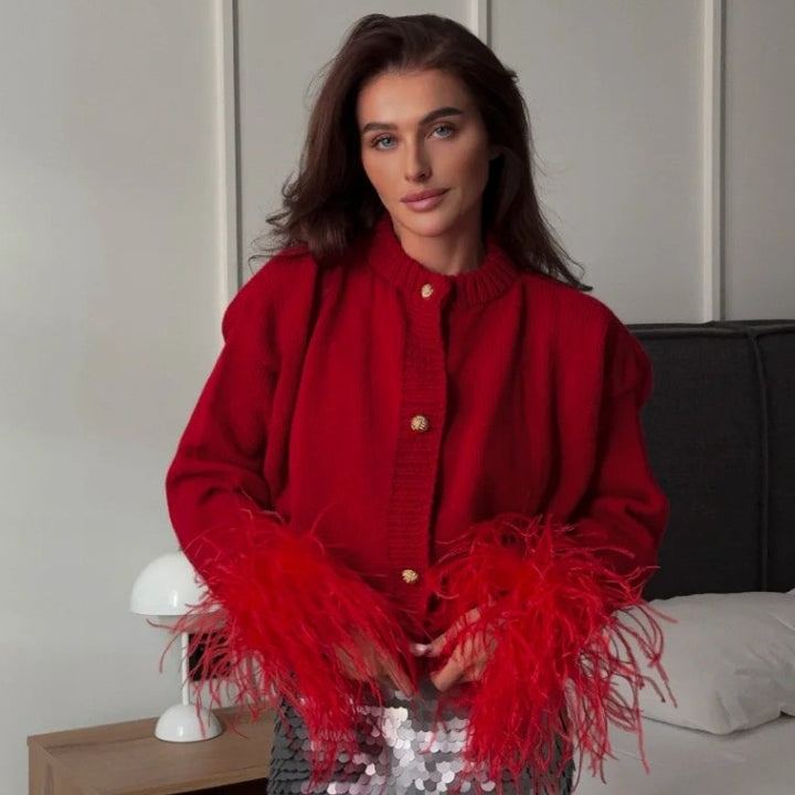 Red feather-trim cardigan on a model, front view